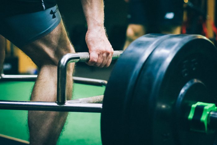 SSA033_F_web Close up image of a man lifting weight